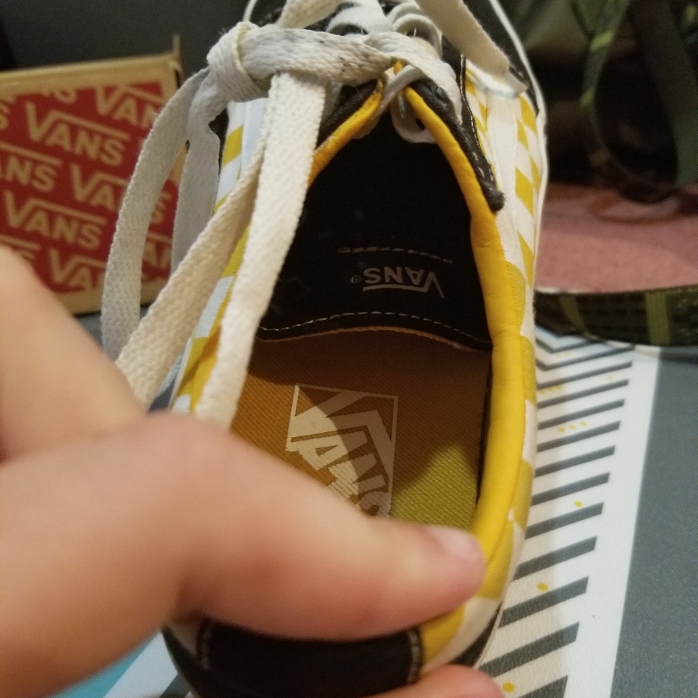 Mustard, white, and black vans